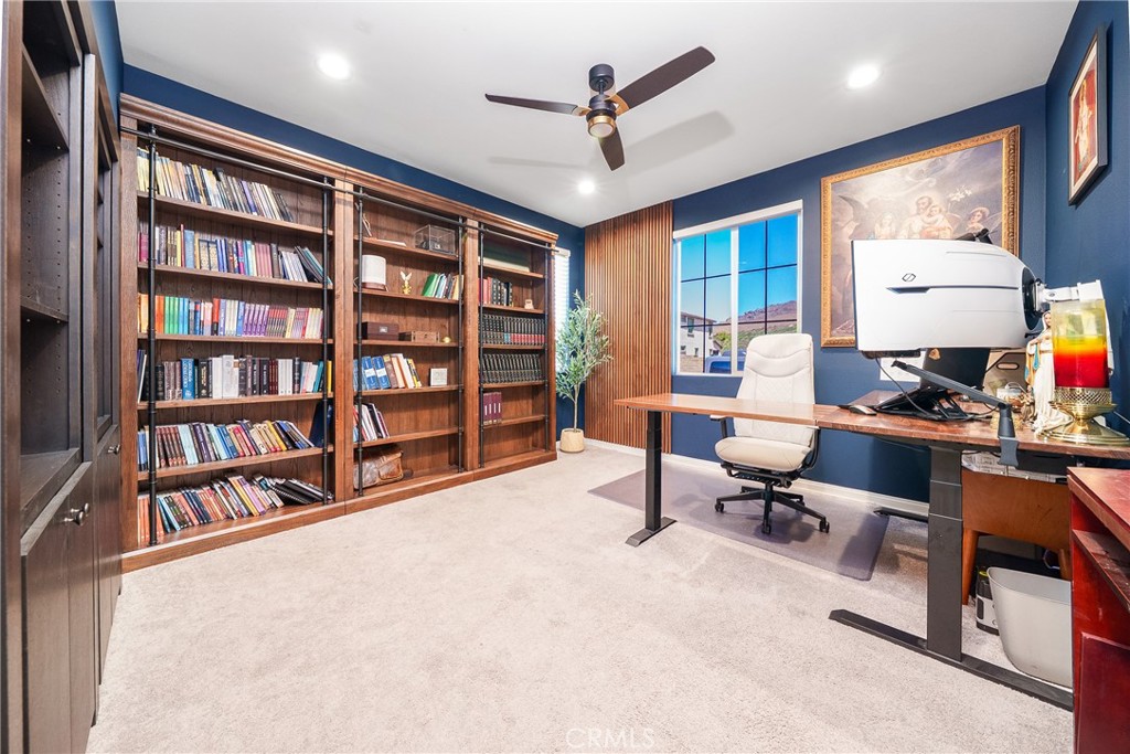 12829 Stags Leap Drive Riverside, CA 92503 - Photo 21 of 54 a workspace with a bookshelf