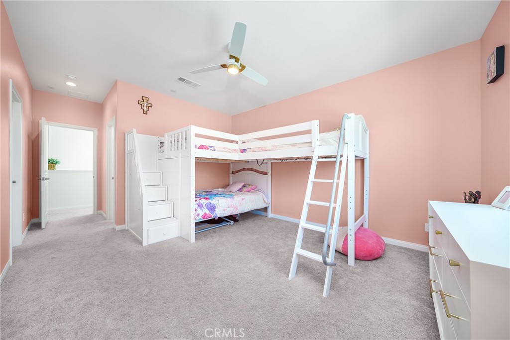 12829 Stags Leap Drive Riverside, CA 92503 - Photo 31 of 54 a room that has a bed and a utility room