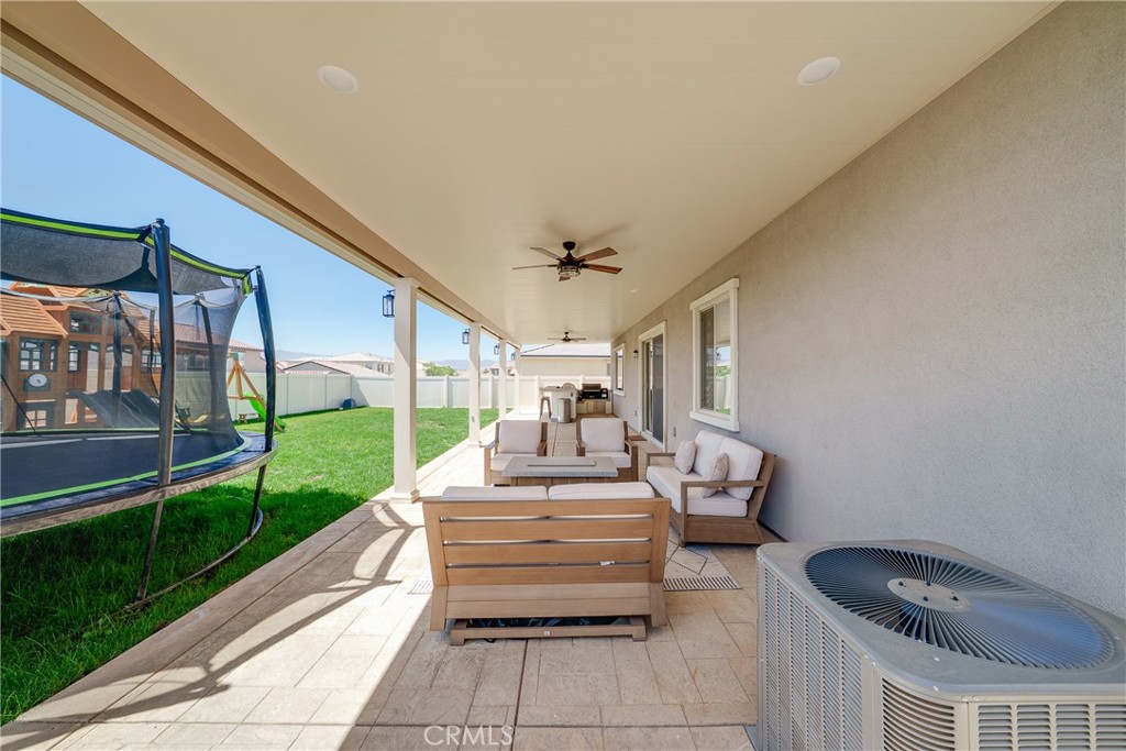 12829 Stags Leap Drive Riverside, CA 92503 - Photo 44 of 54 a balcony view with a dining table and chairs with outer view