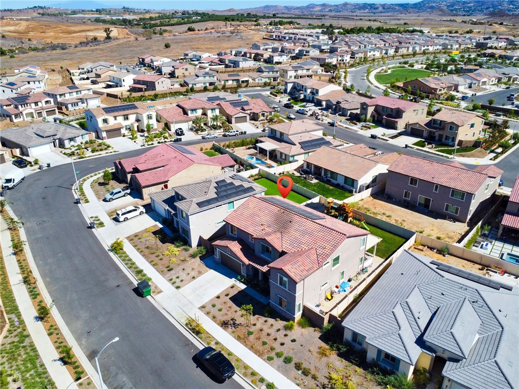12829 Stags Leap Drive Riverside, CA 92503 - Photo 50 of 54 an aerial view of a city with lots of residential buildings