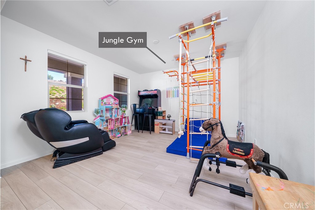12829 Stags Leap Drive Riverside, CA 92503 - Photo 8 of 54 a living room with furniture and a gym machine