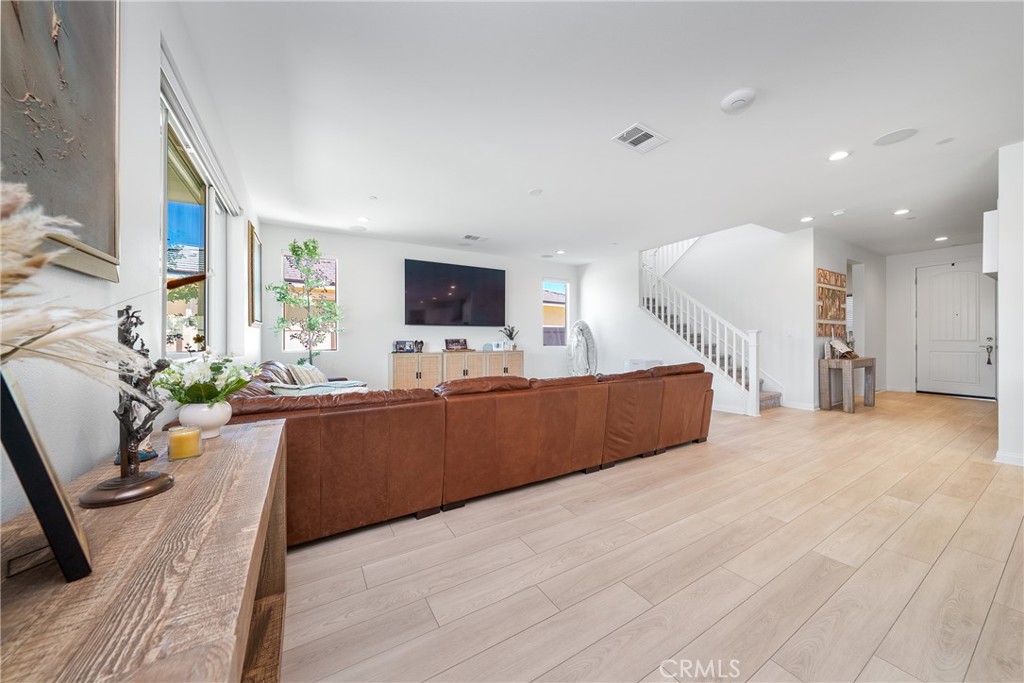 12829 Stags Leap Drive Riverside, CA 92503 - Photo 10 of 54 a living room with furniture and a flat screen tv
