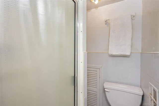 a bathroom with a toilet and a sink