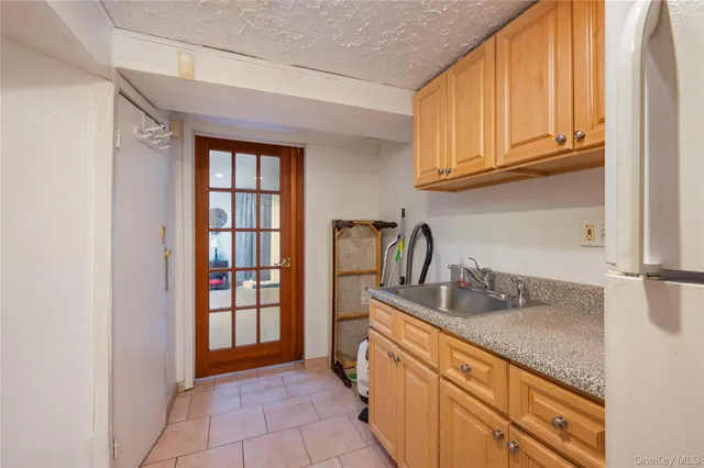 a kitchen with stainless steel appliances granite countertop a sink and cabinets