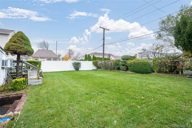 a green field with lots of tress in it