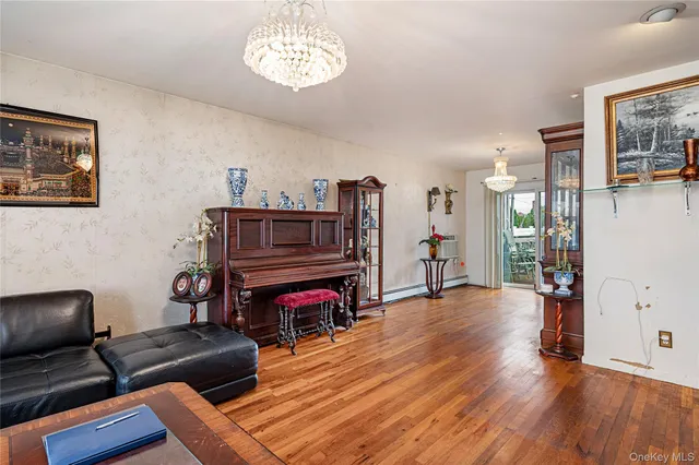 a view of a livingroom with furniture and a flat screen tv