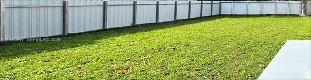 a view of a backyard with tub