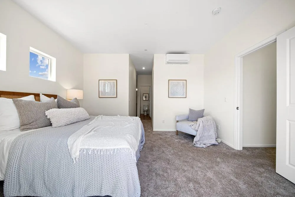 8186 Golden Avenue Lemon Grove, CA 91945 - Photo 20 of 53 a spacious bedroom with a bed and a couch