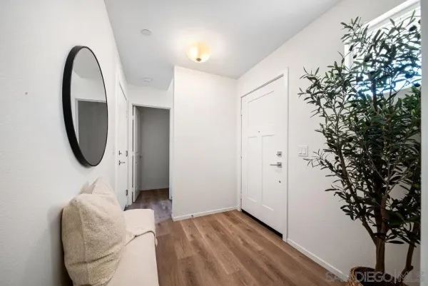 a bedroom with bed and a potted plant