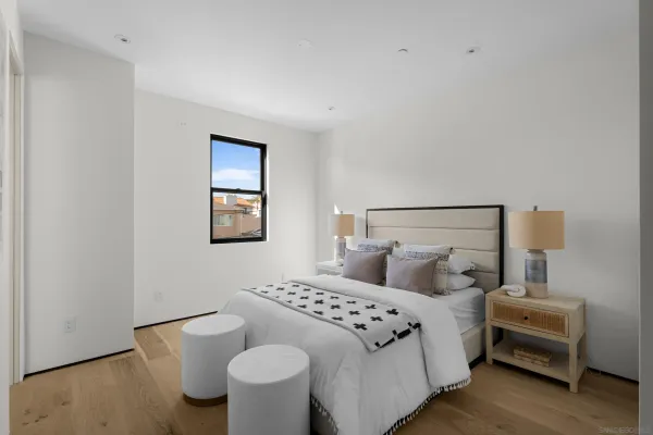 a bedroom with a bed and a cabinets