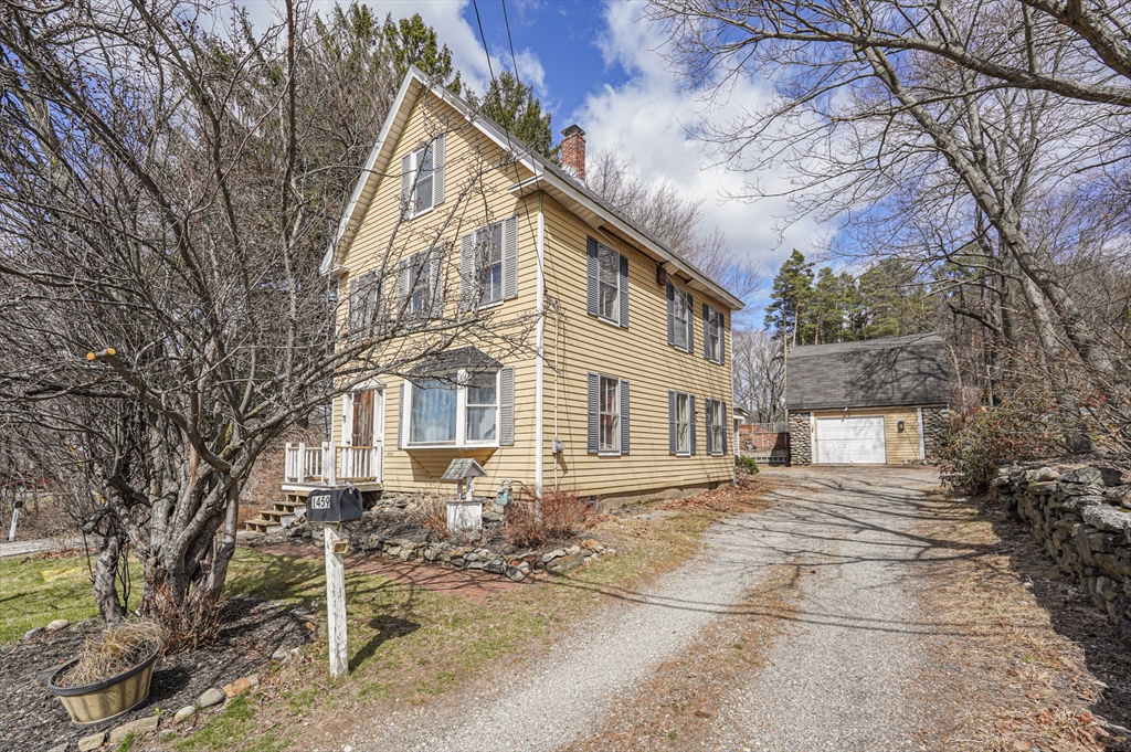 1459 Grafton Road Millbury, MA 01527 - Photo 1 of 42 a front view of a house with a yard