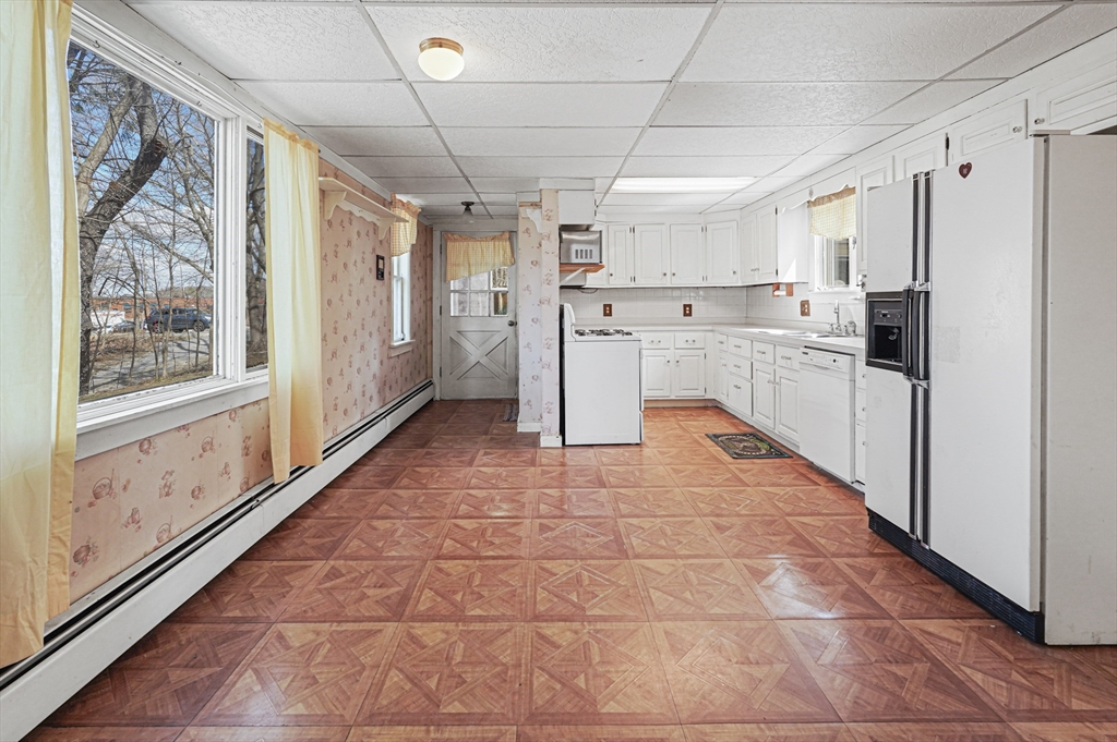 1459 Grafton Road Millbury, MA 01527 - Photo 12 of 42 a kitchen with stainless steel appliances a refrigerator sink and cabinets