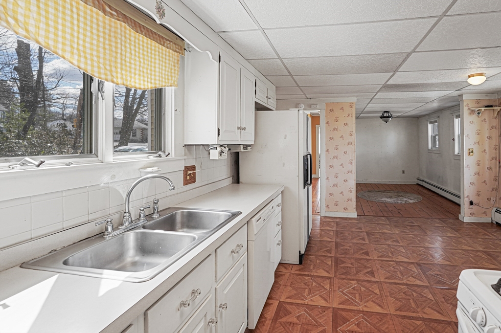 1459 Grafton Road Millbury, MA 01527 - Photo 15 of 42 a kitchen with a sink and a refrigerator