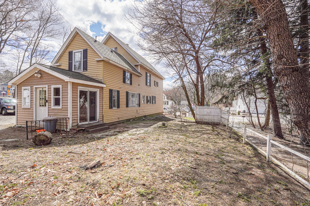 1459 Grafton Road Millbury, MA 01527 - Photo 2 of 42 a front view of a house with a yard