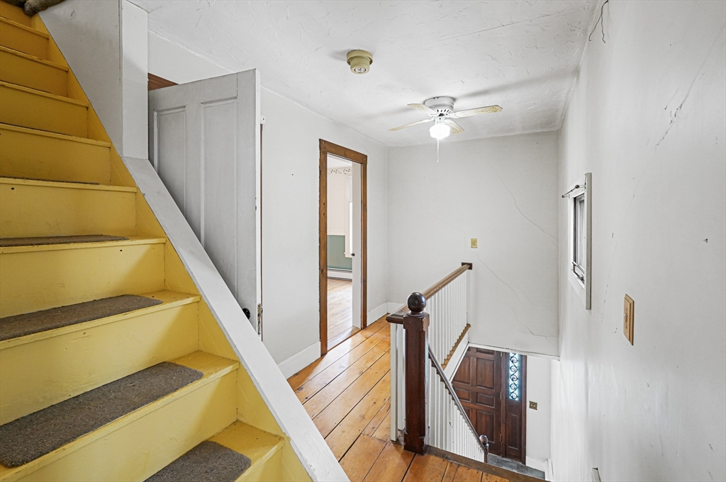 1459 Grafton Road Millbury, MA 01527 - Photo 21 of 42 a view of a hallway with furniture and entryway