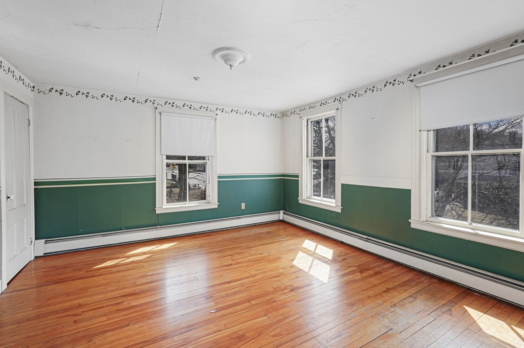 1459 Grafton Road Millbury, MA 01527 - Photo 22 of 42 a view of a room with window and wooden floor