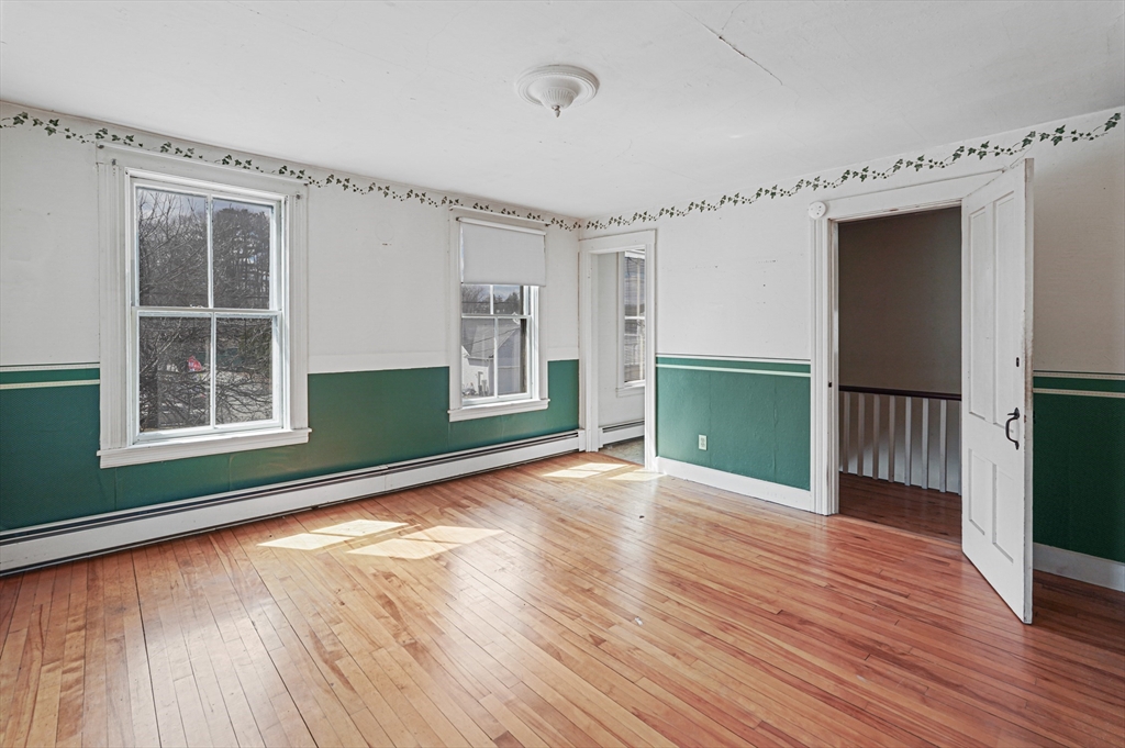 1459 Grafton Road Millbury, MA 01527 - Photo 23 of 42 a view of empty room with wooden floor and fan