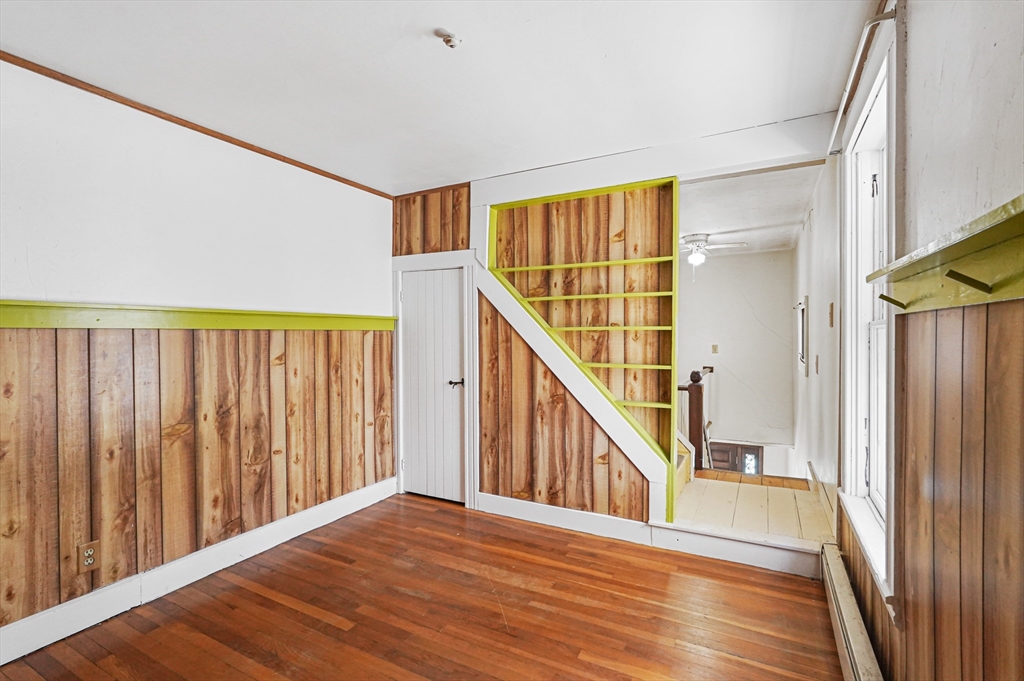 1459 Grafton Road Millbury, MA 01527 - Photo 27 of 42 a view of a hallway with wooden floor and staircase