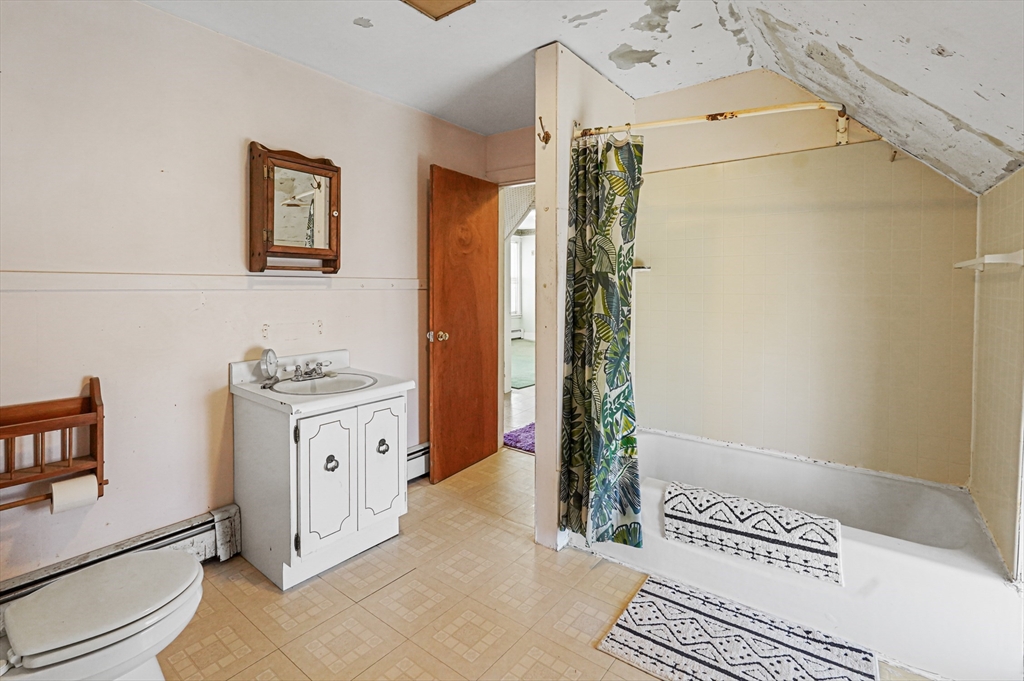 1459 Grafton Road Millbury, MA 01527 - Photo 31 of 42 a spacious bathroom with a granite countertop tub sink a mirror and shower