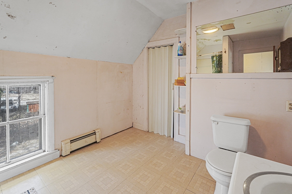 1459 Grafton Road Millbury, MA 01527 - Photo 32 of 42 a view of a bathroom with a tub and shower
