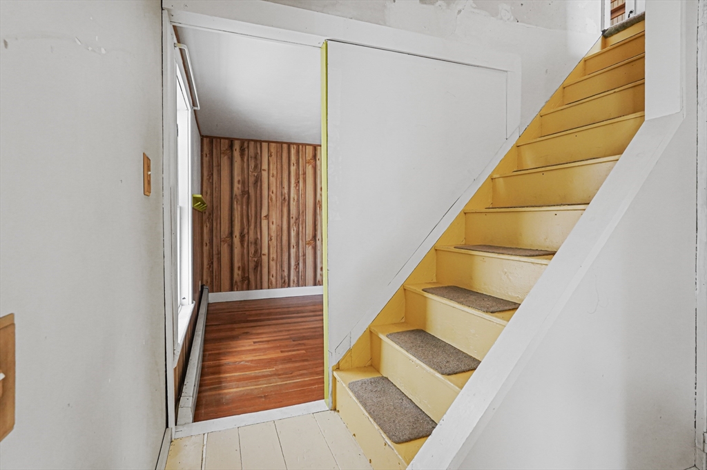 1459 Grafton Road Millbury, MA 01527 - Photo 33 of 42 a view of staircase with wooden floor and white walls