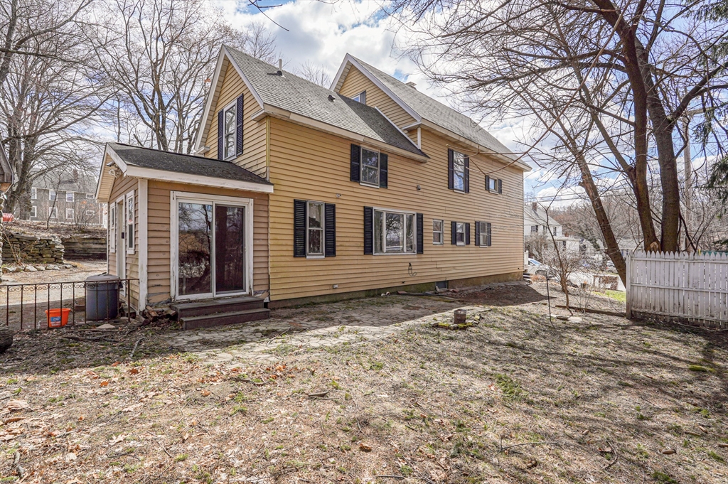 1459 Grafton Road Millbury, MA 01527 - Photo 4 of 42 a house with trees in the background