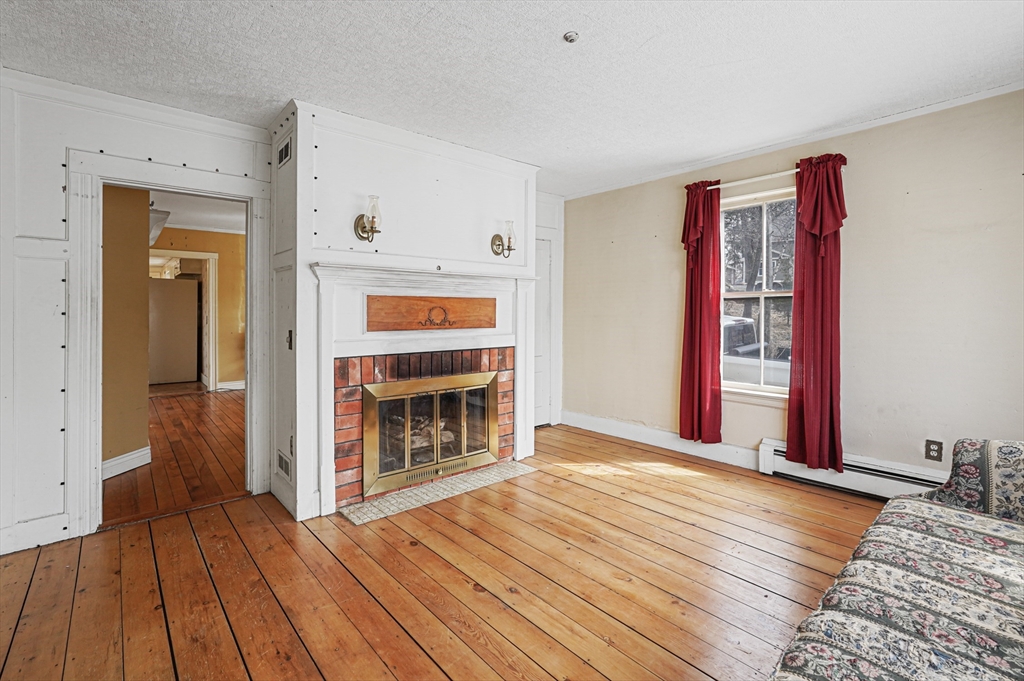 1459 Grafton Road Millbury, MA 01527 - Photo 6 of 42 a view of livingroom with hardwood floor and hallway