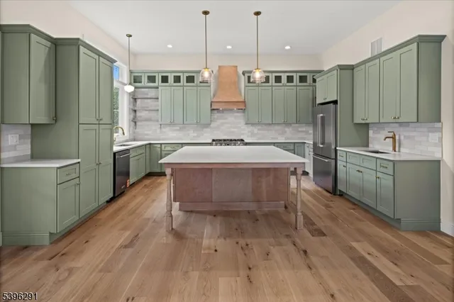 a kitchen with a stove a sink and a window