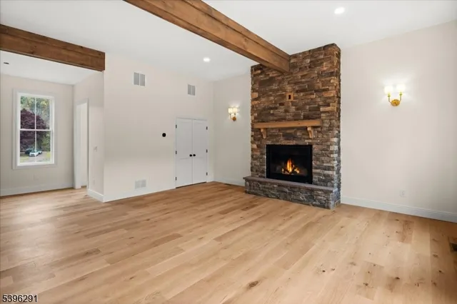 a view of a roof with wooden fence and floor