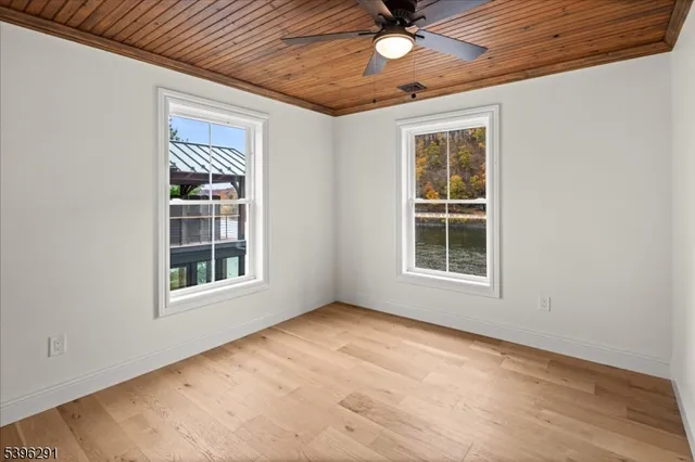 a bathroom with a double vanity sink a toilet and a mirror