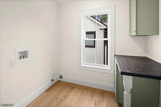 a bathroom with a double vanity sink mirror and toilet