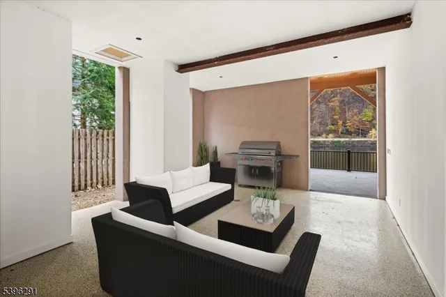 a view of a balcony with wooden floor