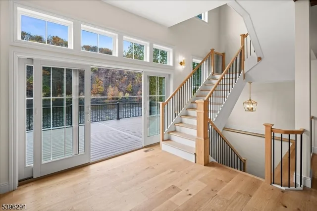 a view of an entryway with wooden floor