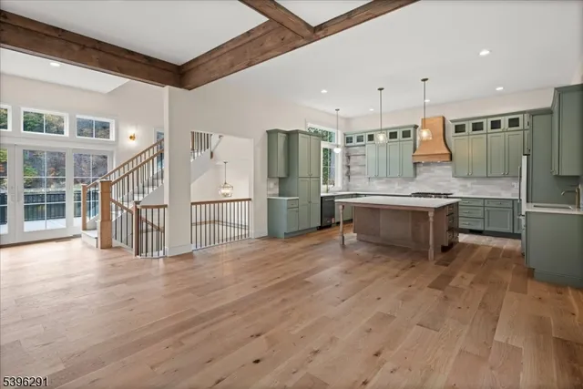 a kitchen with a stove a sink and a refrigerator