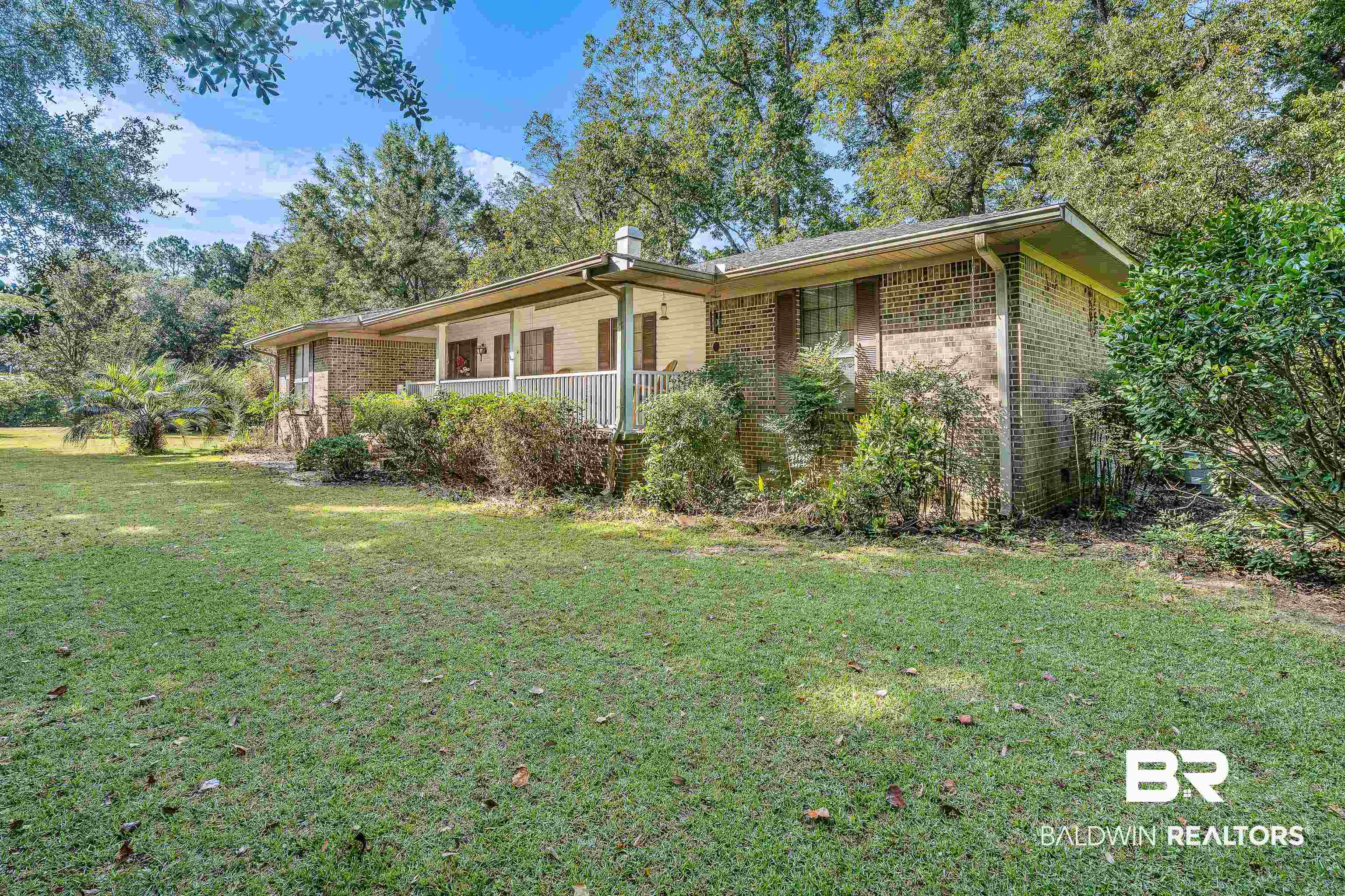 72075 Highway 59 Little River, AL 36550 - Photo 2 of 40 View of front of house featuring a front lawn and brick siding