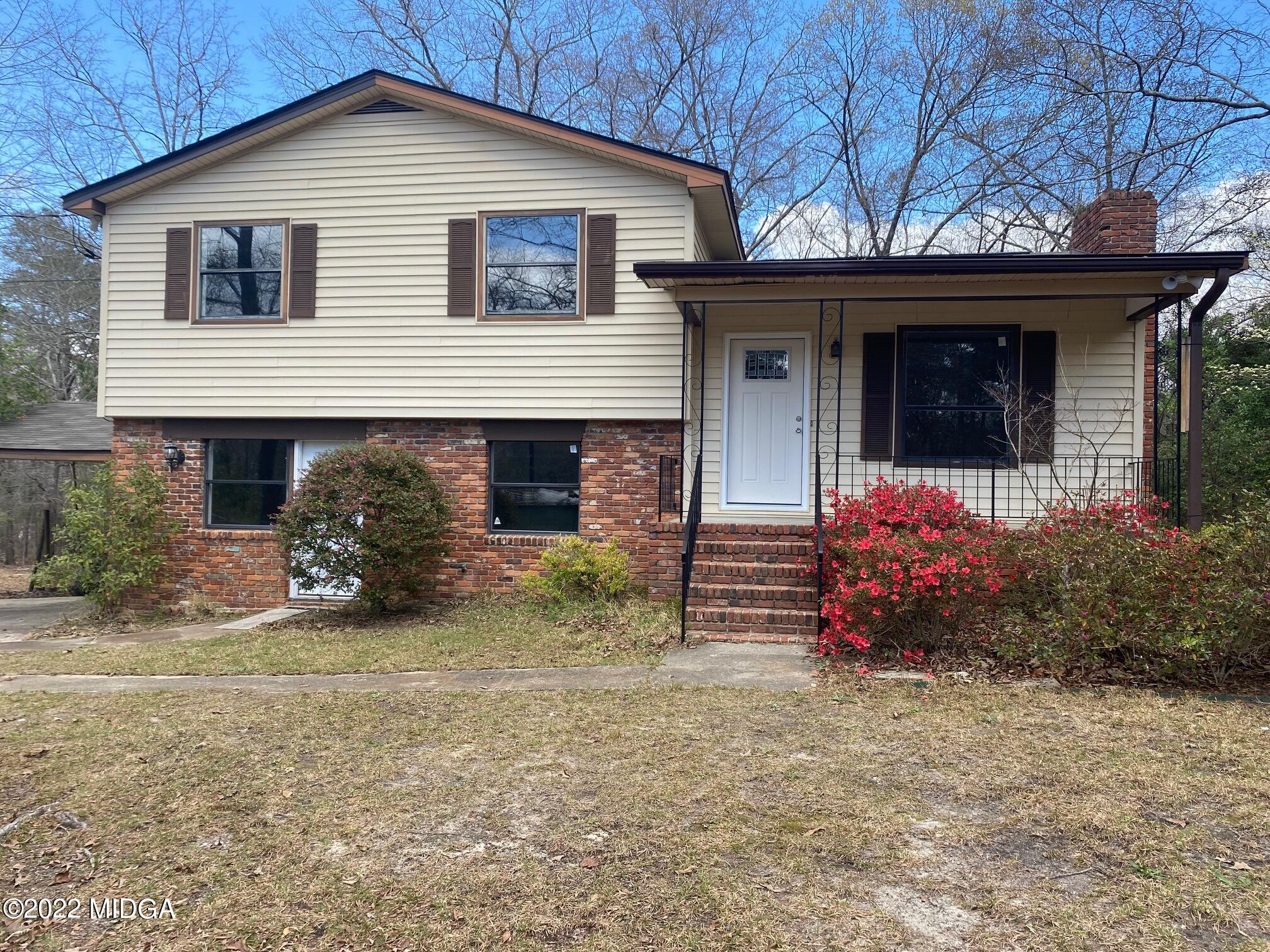 114 Pine Tree Road Macon, GA 31211 - Photo 1 of 18 a view of a house with a yard