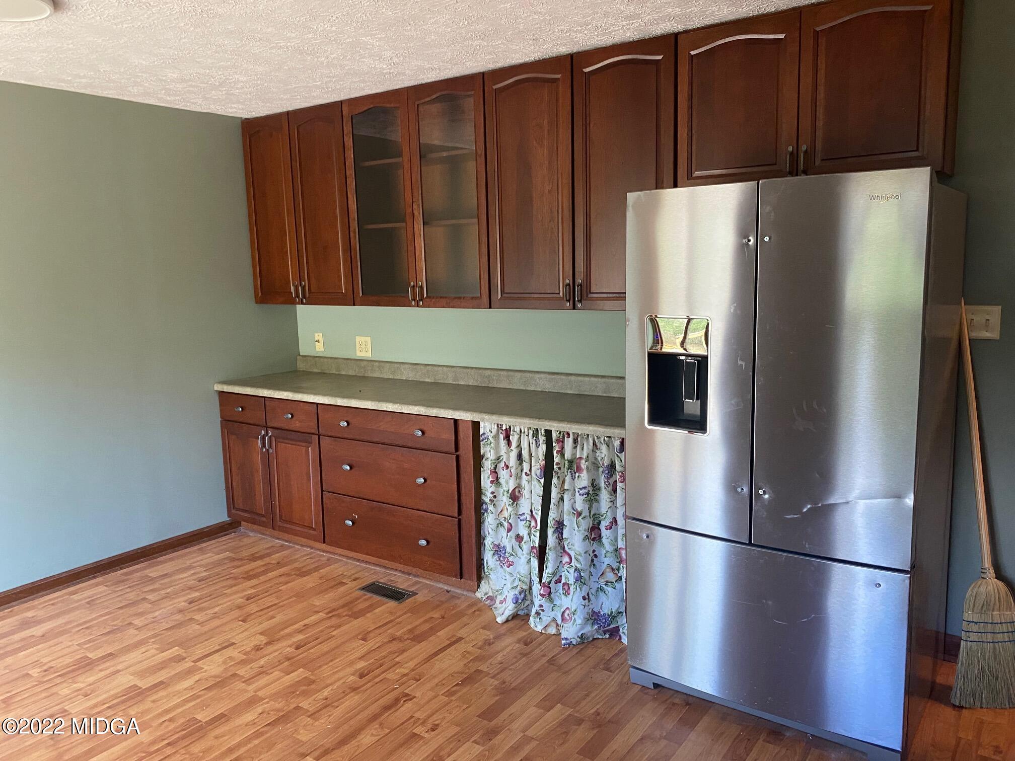 114 Pine Tree Road Macon, GA 31211 - Photo 12 of 18 a kitchen with stainless steel appliances a refrigerator and a cabinets