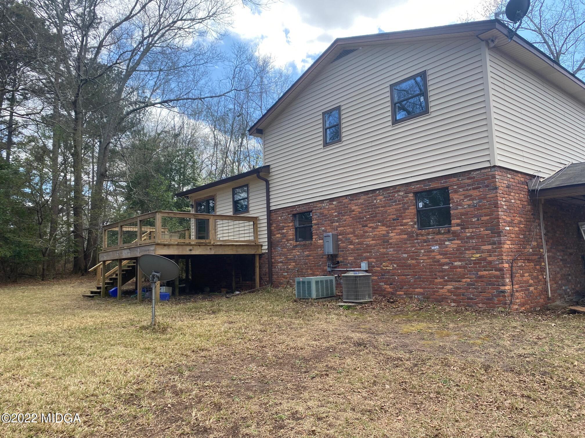 114 Pine Tree Road Macon, GA 31211 - Photo 15 of 18 a backyard of a house with table and chairs