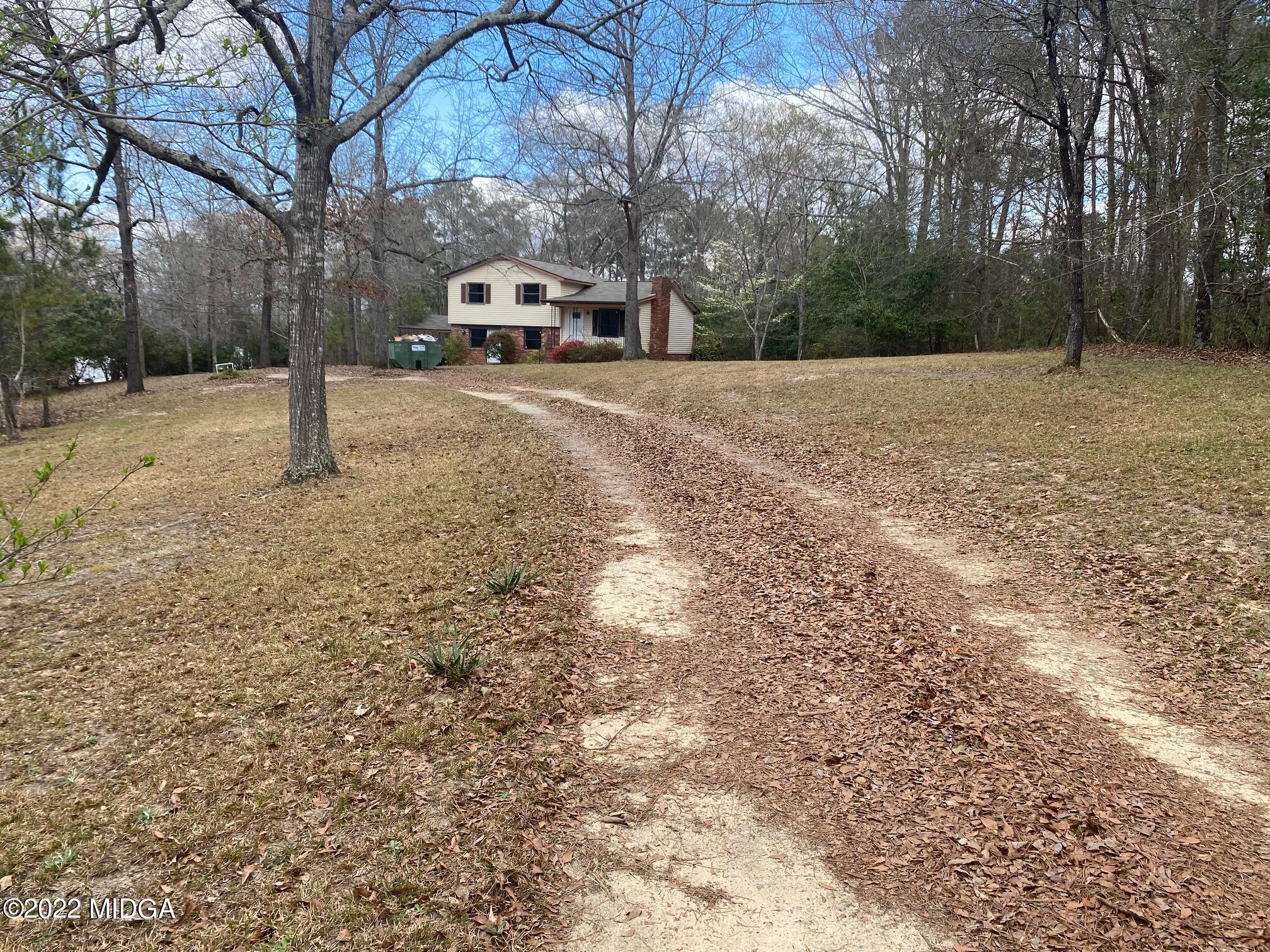 114 Pine Tree Road Macon, GA 31211 - Photo 2 of 18 a backyard of a house with lots of green space