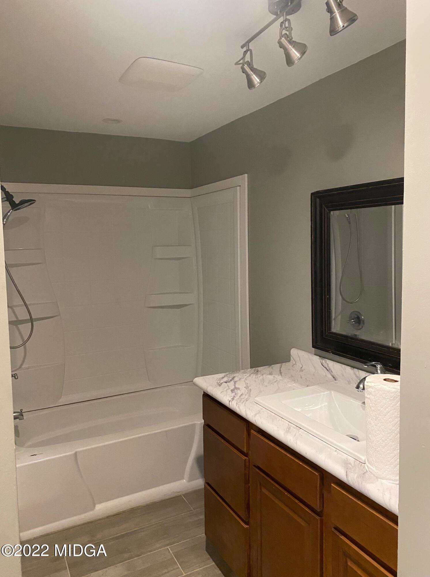 114 Pine Tree Road Macon, GA 31211 - Photo 3 of 18 a bathroom with a bathtub and a sink