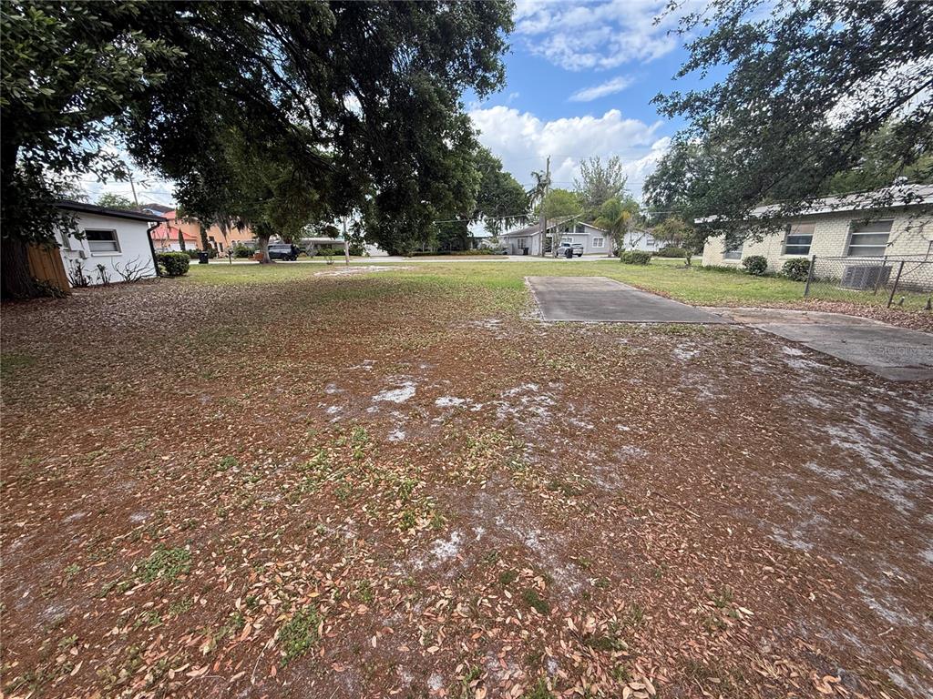5717 Moonlight Circle Orlando, FL 32839 - Photo 5 of 5 a view of a house with a yard and trees