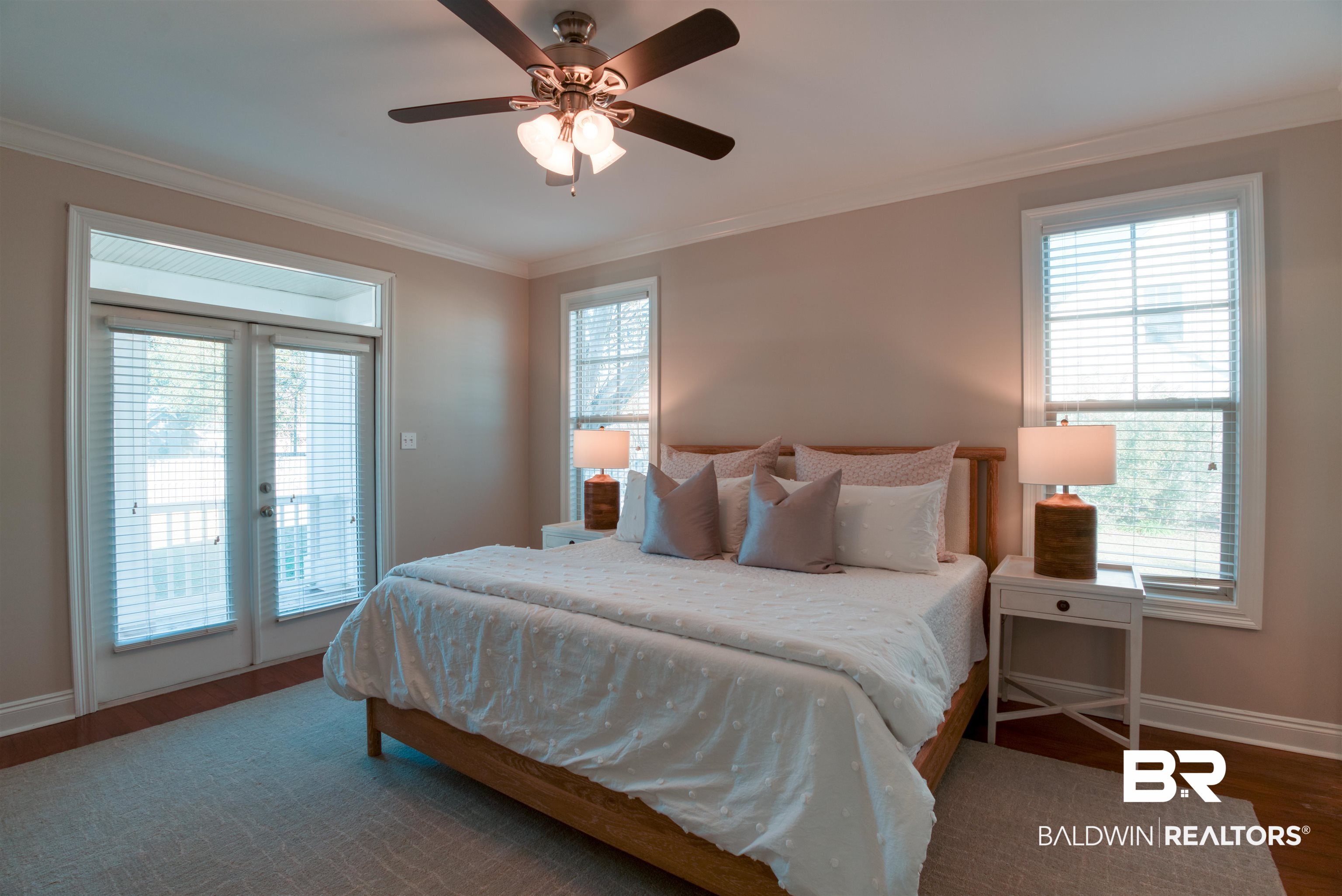 24561 Austin Road Daphne, AL 36526 - Photo 19 of 57 Bedroom with french doors, ceiling fan, dark hardwood / wood-style floors, access to exterior, and ornamental molding