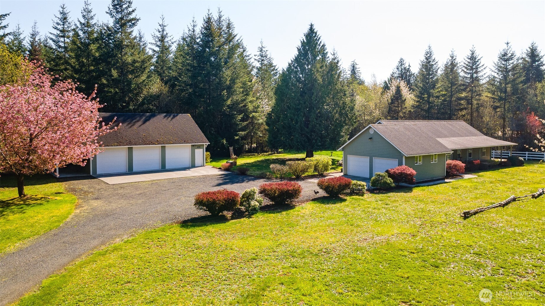 698 Logan Hill Road Chehalis, WA 98532 - Photo 1 of 35 a yellow house with trees in front of it