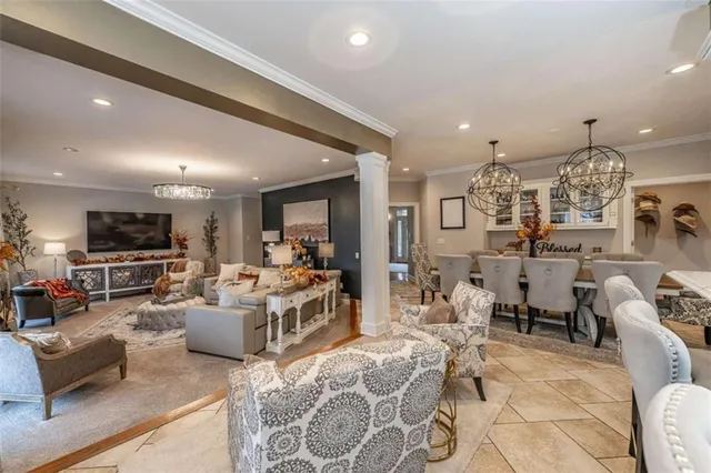 a large white kitchen with a large window cabinets and stainless steel appliances