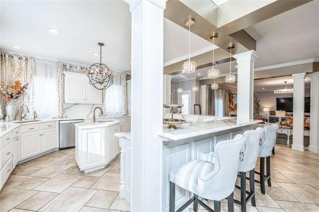 159 Ward Mountain Road Kingston, GA 30145 - Photo 13 of 75 a large white kitchen with a sink and cabinets
