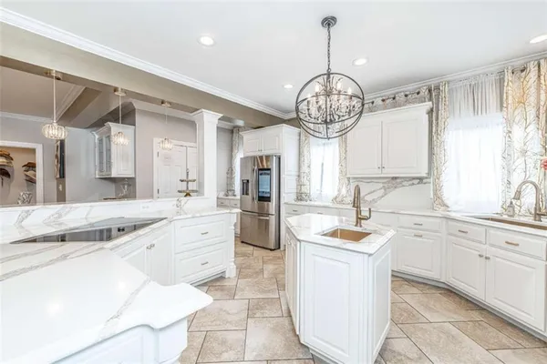 a bathroom with a granite countertop tub shower and sink