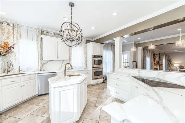 a spacious bathroom with a large tub shower and windows