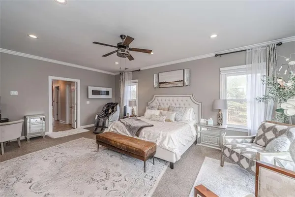 a living room with furniture and a book shelf
