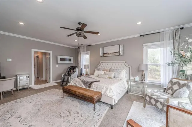 a living room with furniture and a book shelf