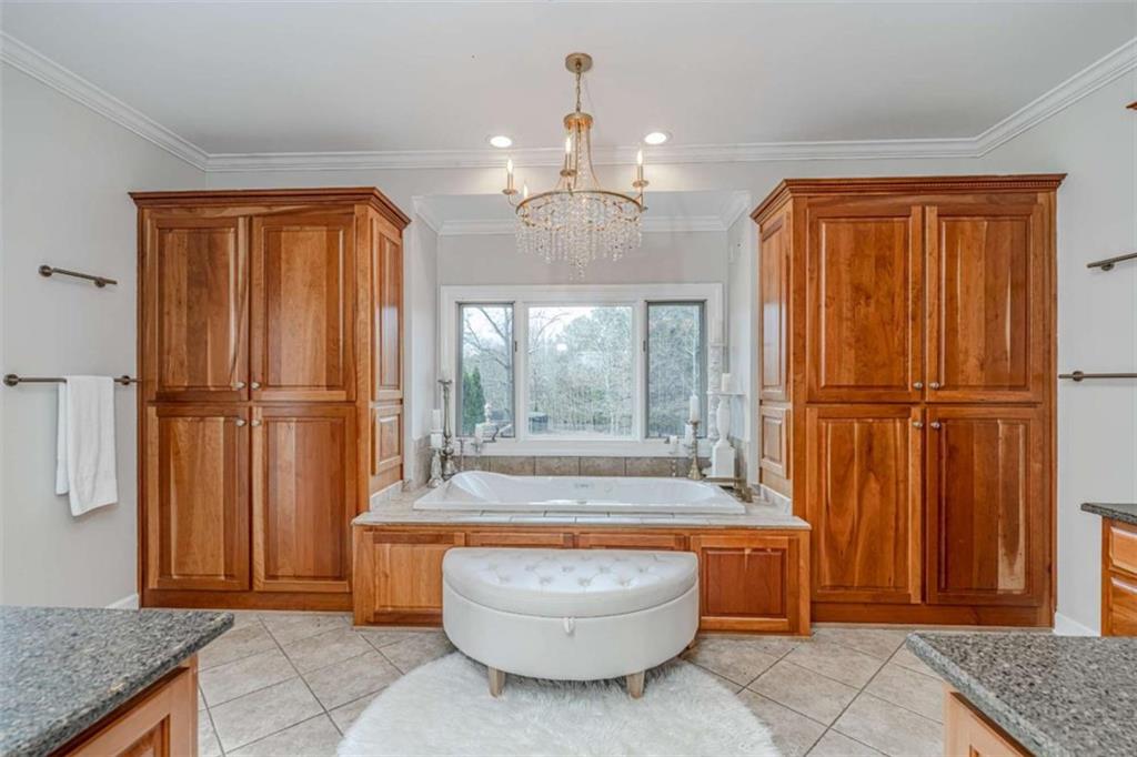 159 Ward Mountain Road Kingston, GA 30145 - Photo 20 of 75 a bathroom with a granite countertop tub shower and sink
